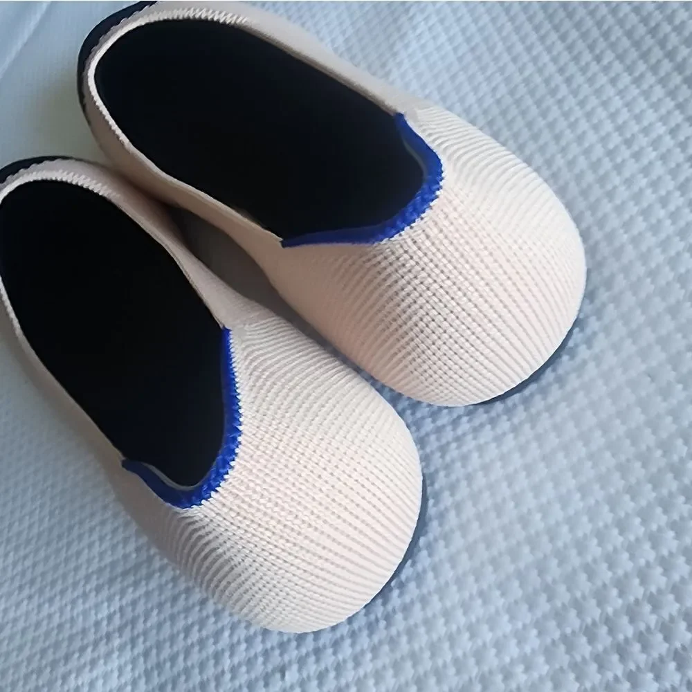 Rothy's Black and soft pink Flats with Elegant Two-Tone Design